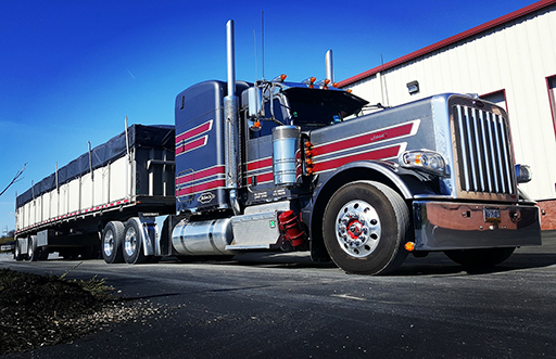 143 Peterbilt pulling flat with sides