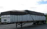 Loaded flatbed with tarp and sides